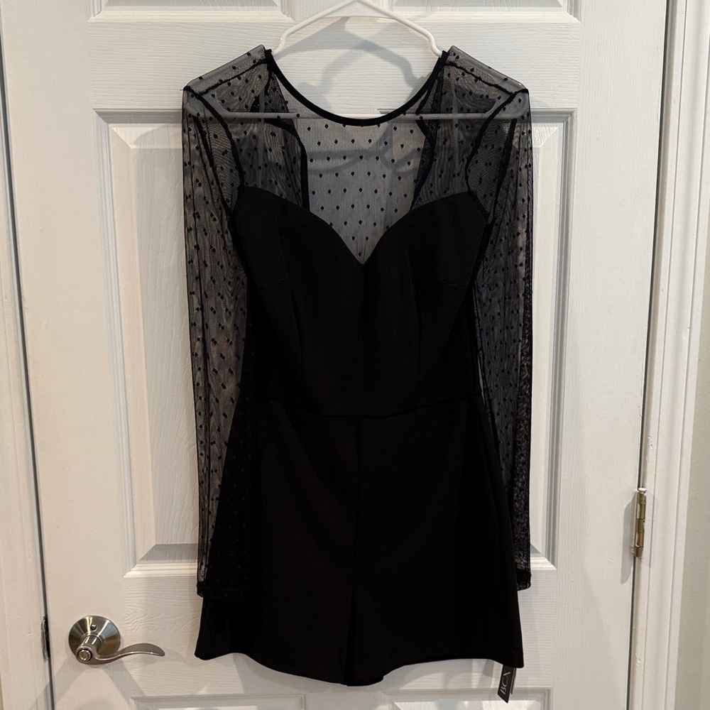 Elegant Black Romper with Sheer Polka Dot Sleeves